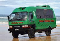 Un bus 4x4 avec air conditionné pour la visite à l'île Fraser